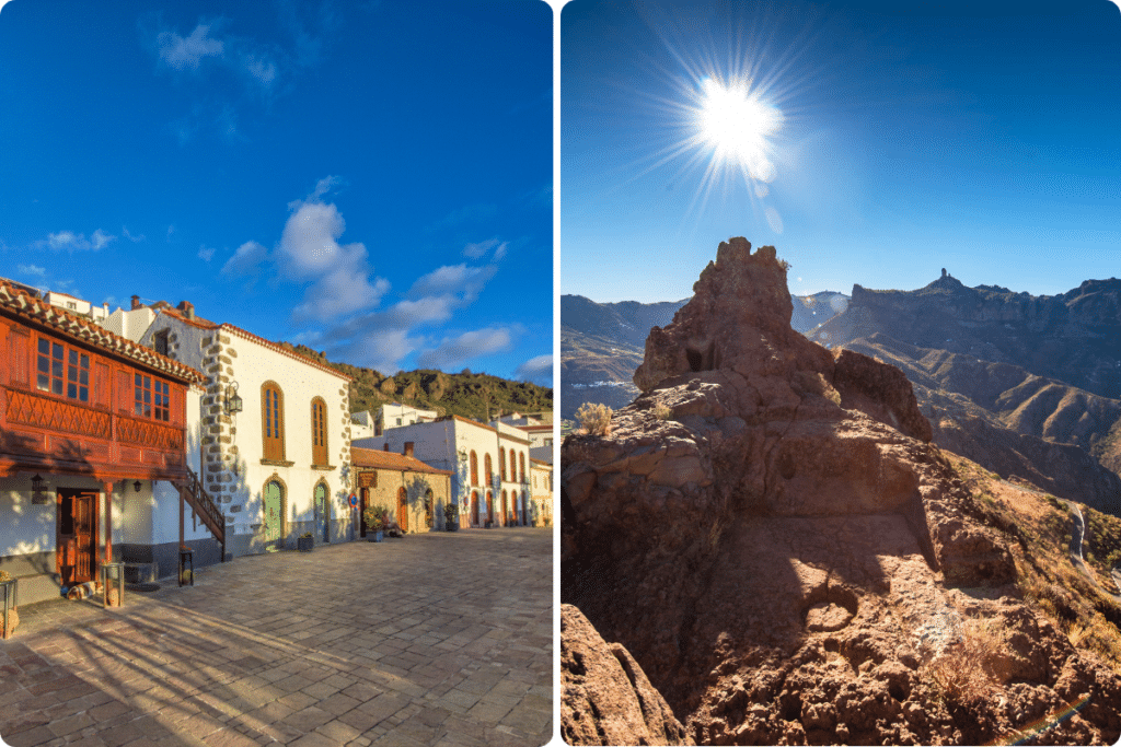 Una soleada plaza de pueblo con edificios tradicionales a la izquierda y un paisaje montañoso rocoso con un sol brillante en un cielo azul claro a la derecha.